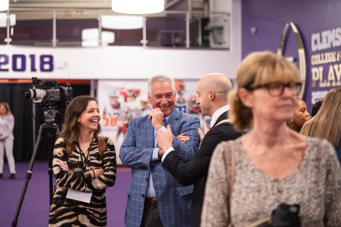 A group of people laughing together.