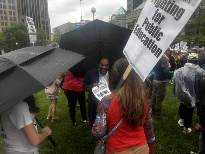 This is a photo of Ohio state Senator Hearcel Craig speaking to a protester at the 2025 May Day protest in Columbus.