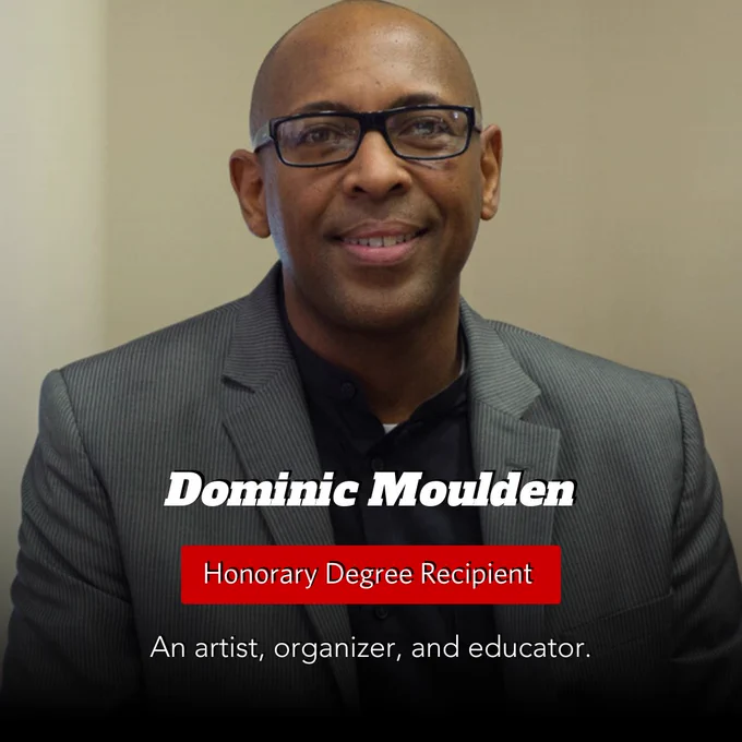 A man with a blurred face is wearing a gray suit jacket over a black shirt. The text on the image reads "Dominic Moulden, Honorary Degree Recipient. An artist, organizer, and educator."