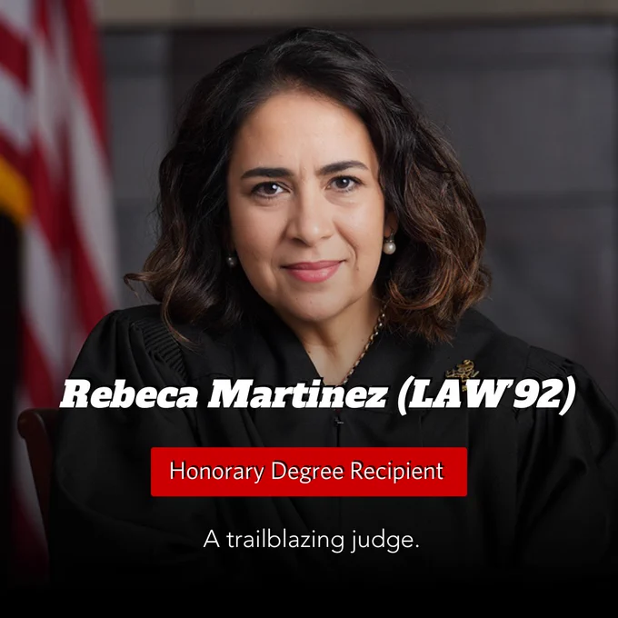 A blurred portrait of a person with shoulder-length hair, wearing a black judicial robe. The background includes an American flag. Text on the image reads: "Rebeca Martinez (LAW'92) Honorary Degree Recipient. A trailblazing judge."
