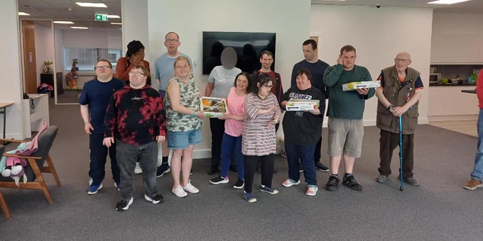 Customers posing with the refreshments they were given by Unity Campus.