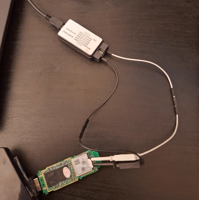 A Logical Analyzer connected, via IC clips, to a 3G USB modem stick.