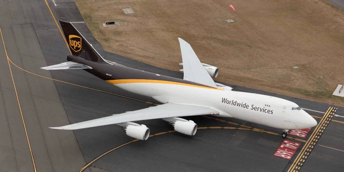 Overhead shot of a UPS plane on an airport runway. 