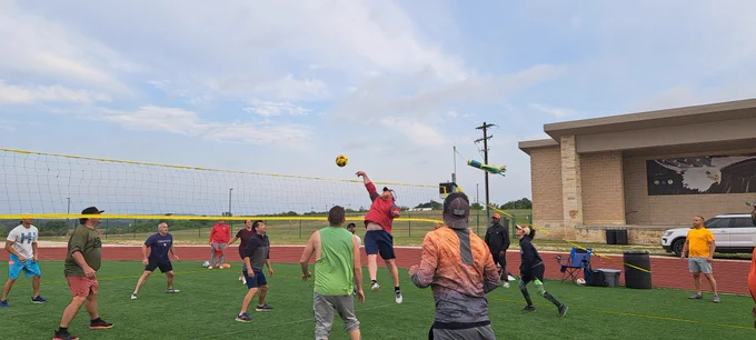 Competition at the net is fierce as players compete in volleyball during the 20th Annual Garrison Org Day at Fort Cavazos.