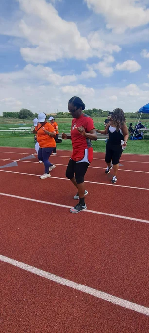 Col. Lakicia Stokes, U.S. Army Garrison-Fort Cavazos commander, joins in a line dance during the 20th Annual Garrison Org Day at Fort Cavazos.