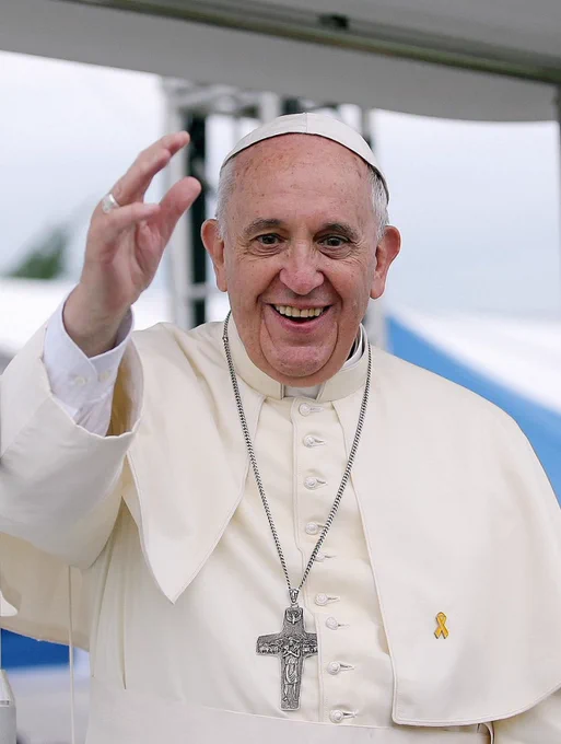 Pope Francis smiling and waving
