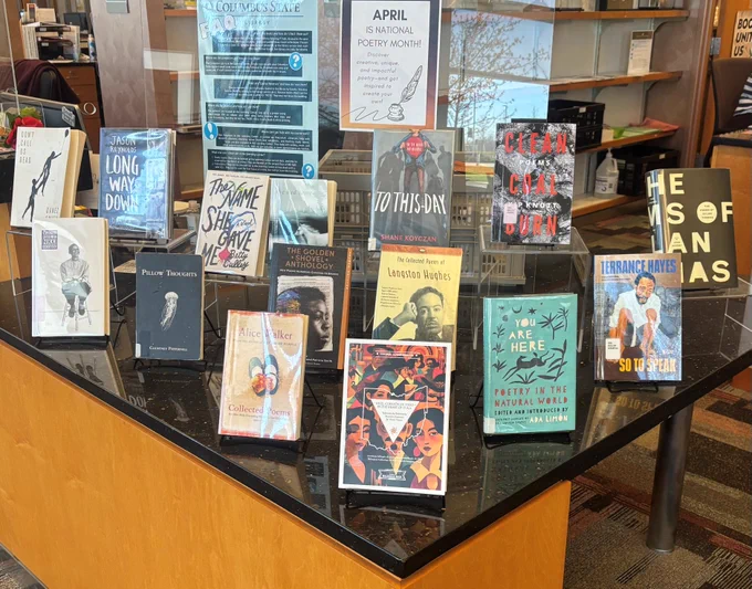 Tabletop display of poetry books.