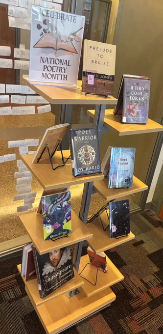 Standing display of poetry books.