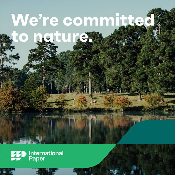 A lake, with a grazing cow and pine trees in the background with the words We're Committed to Nature.