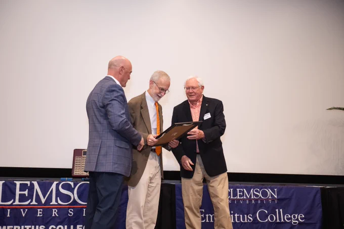 Provost Jones receiving an award on stage from the Emeritus College.