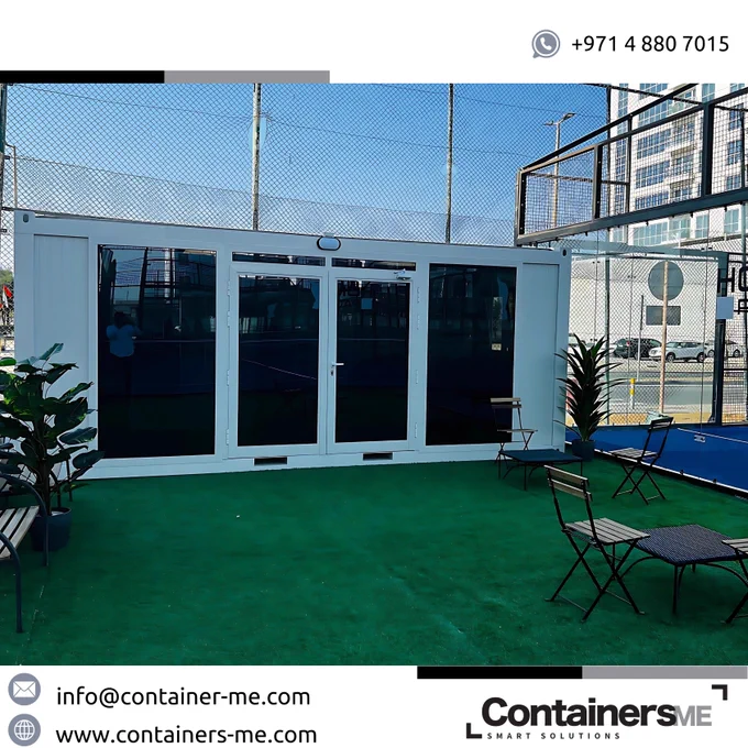 waiting room made using modular prefab container near a tenis court
