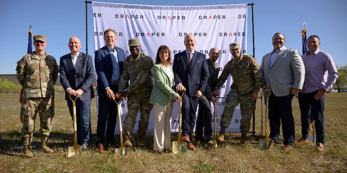 Left to right:  Col Daniel L. Cornelius, USAF; Utah Governor Spencer Cox; U.S. Congressman Blake Moore; Maj Gen Kenyon K. Bell, USAF; Julia Laurenzano MacDonough, Draper; Jerry Wohletz, Draper; Paul Hendrickson, Ph.D., Draper; Col Joseph Hank, USAF; Taylor Woodbury, Woodbury Corp; and Mark Dalton, Hunt Cos