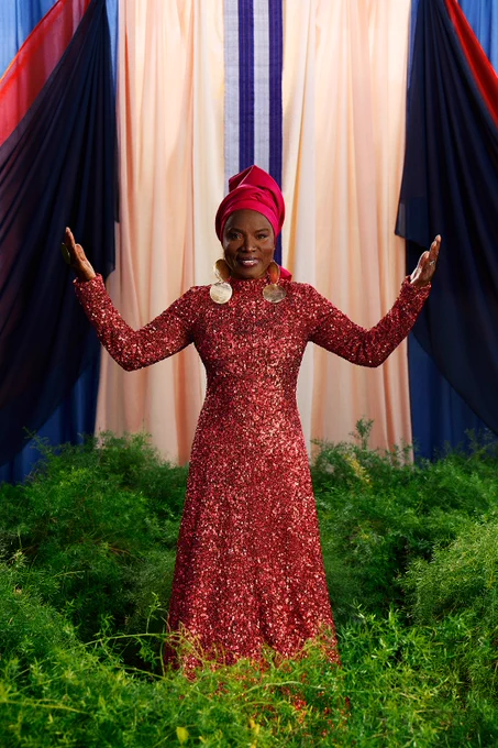 Angelique Kidjo in a red sparkly dress