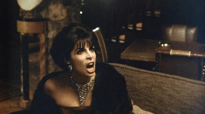 A still from The Godfather Part II featuring Connie Corleone played by Talia Shire.