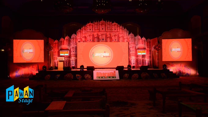  A spacious stage with a big screen, prepared for the Bharathi Cement dealers meeting at Fairmont Jaipur.

