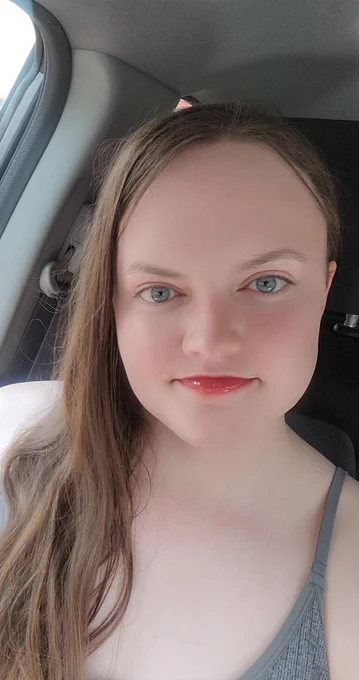 woman in car smiling