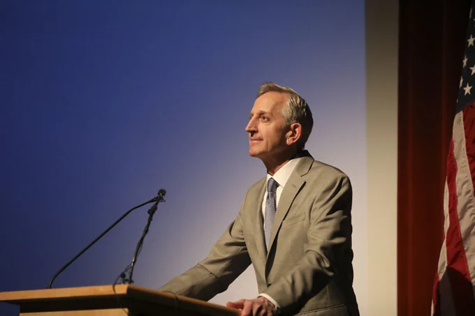 Photo of Mayor Wilson standing at a podium giving his State of the City address at Franklin High School