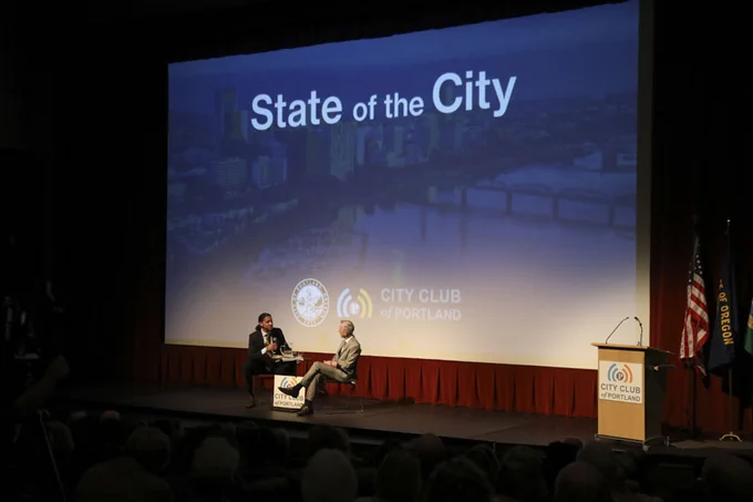 Mayor Wilson and JT Flowers sitting on the stage at Franklin High School having a conversation during the State of the City event