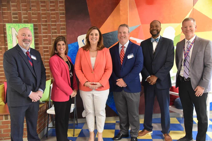 Ellen Weaver with District officials