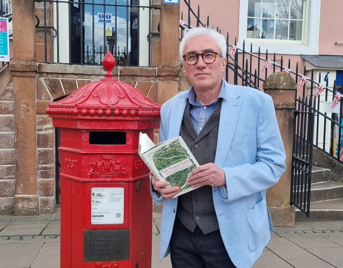 Alan at the commemorative Carlisle postbox with his new book.