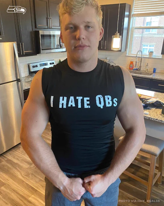 Riley Mills wearing a shift that says "I hate QBs"