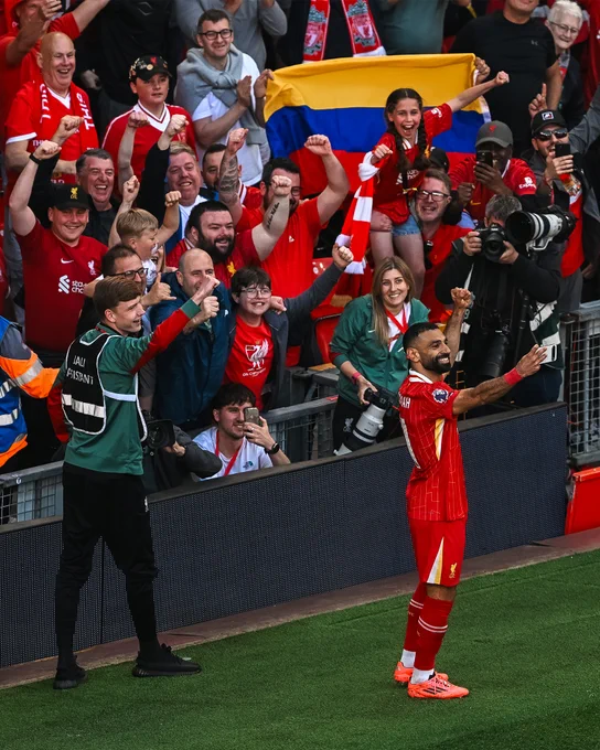 Photography of Mo Salah celebrating his goal against Tottenham.