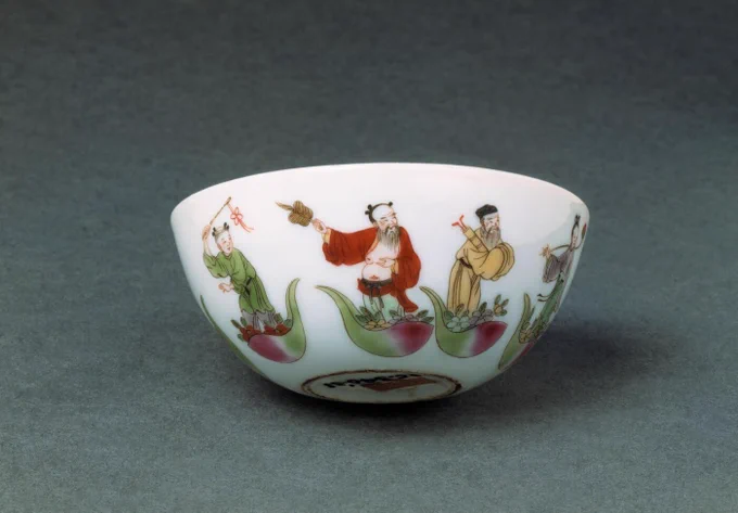 Cup showing a number of figures in floating boats