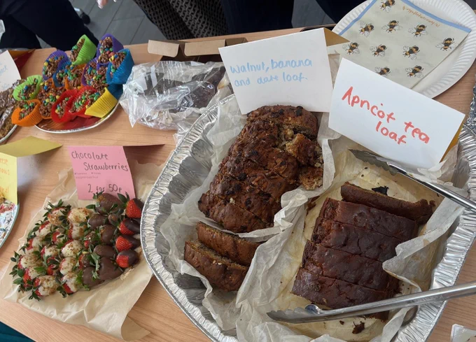 Assortment of cakes on table at bake sale