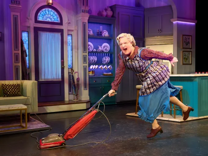 Mrs Doubtfire vacuums the floor with a spring in her step!