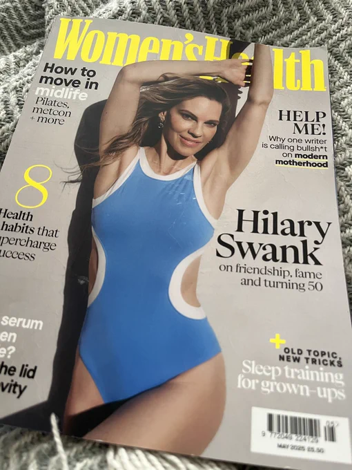 A picture of Women's Health magazine, on the cover is Hilary Swank in a swimsuit. 