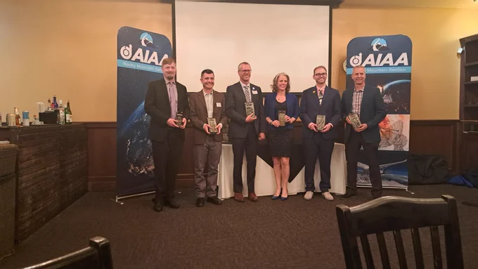 Six people accept awards