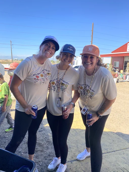 Mrs. Lussenhop standing with 2 other staff members
