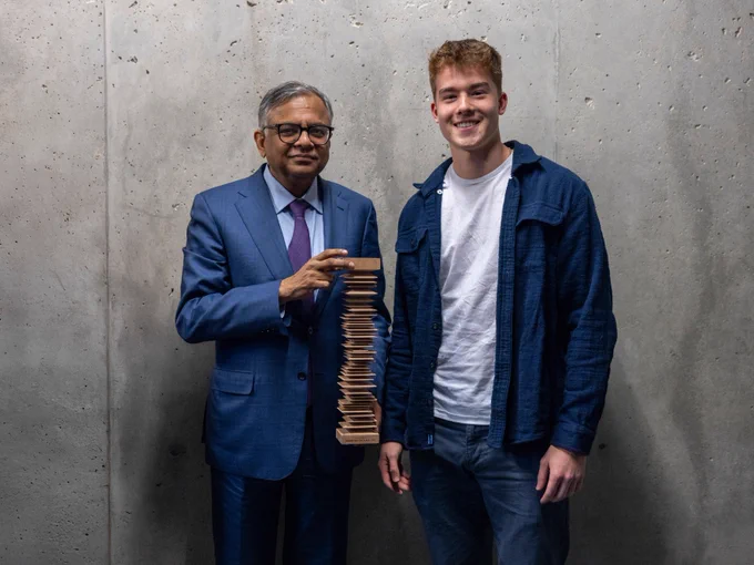 Natarajan Chandrasekaran, Chairman of Tata Sons, with first-year architecture student Blake Zimmerman (B.Arch. '29), who crafted the wooden model that carried the award's inscription. 