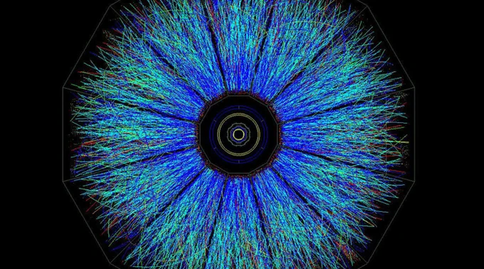  A colorful image of ion collisions that resembles an eye.