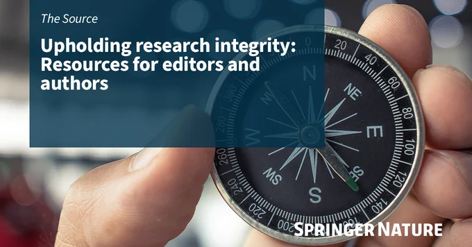 A close-up image of a hand holding a compass.  Overlaid on the image is a blue transparent box with white text that reads, 'The Source: Upholding research integrity: Resources for editors and authors.' In the bottom right corner, there is a white Springer Nature Logo.