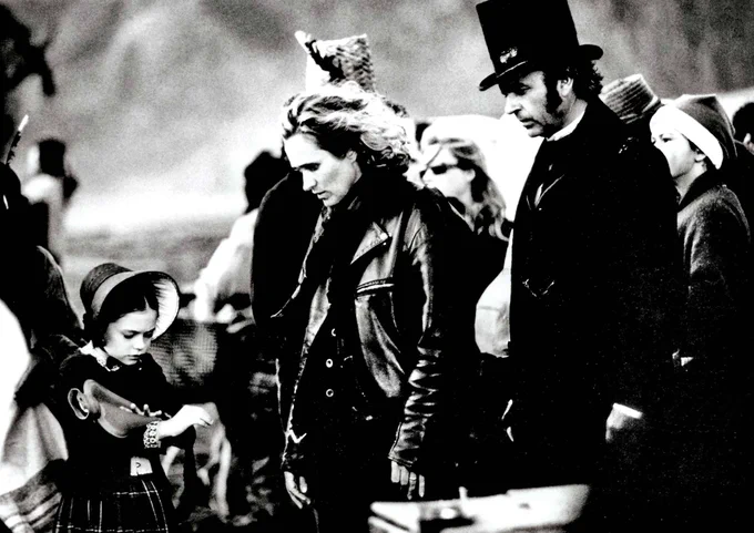A black and white behind the scenes photograph from The Piano featuring Anna Paquin, Jane Campion and Sam Neill.