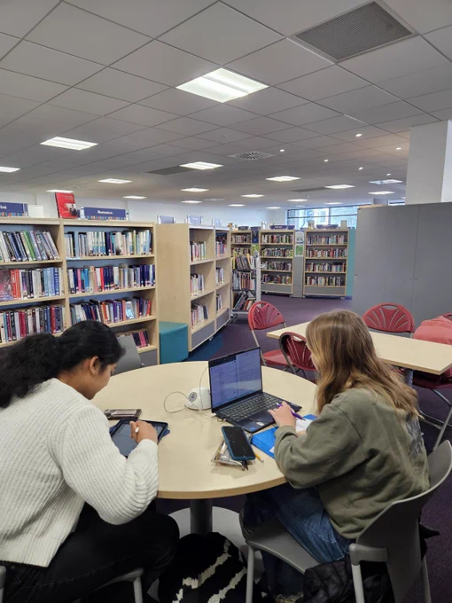 People studying in a library