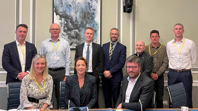 Minister Kimmins (front row, centre) with members of the NI Chamber of of Commerce and Industry