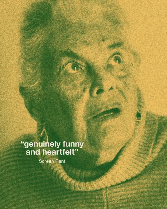 Grainy green and yellow-tinted image of an older woman with short white hair, wearing a ribbed turtleneck jumper. She looks upwards with an expression of surprise or wonder. Text reads “genuinely funny and heartfelt” – Screen Rant.