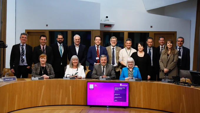 A group shot of members of the Rural Affairs & Islands Committee and deer management stakeholders.