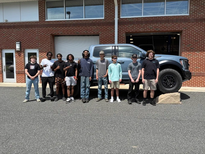 WTHS Automotive students checking out a new Ford "Raptor"