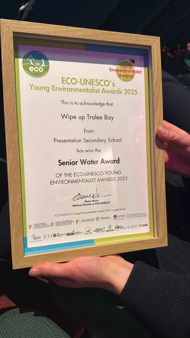Close-up of hands holding the award certificate ECO-UNESCO's Young Environmentalist Awards 2025.
