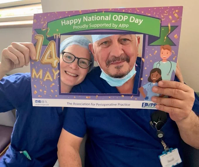 Two healthcare professionals in scrubs holding a sign that reads "Happy National ODP Day" supported by AFPP, with illustrations of medical staff and children on the sign.