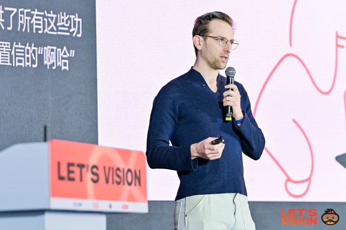 Image of Ryan on stage presenting