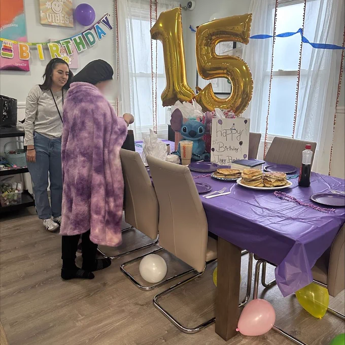 A Lisa's House client celebrating their 15th birthday (right) with staff member (left).