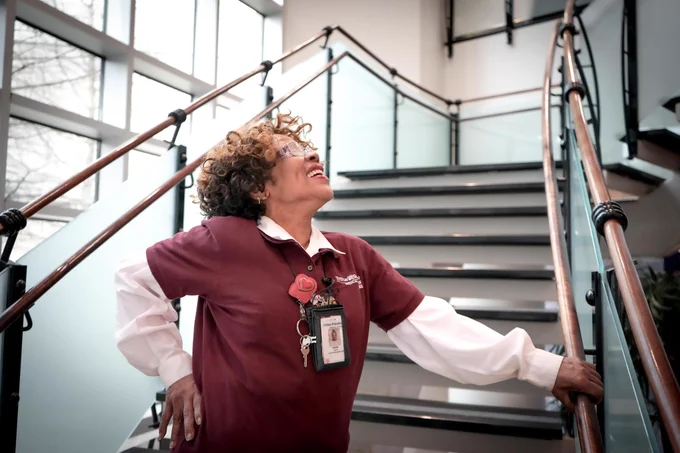 HCA Healthcare colleague Faye Duke posing on hospital hallway stairs
