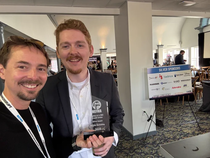 Scott and Jay holding the Silver NEFFIE Award for Digital Marketing