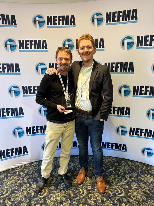 Scott and Jay holding the Silver NEFFIE Award for Digital Marketing at the Spring 2025 NEFMA Conference
