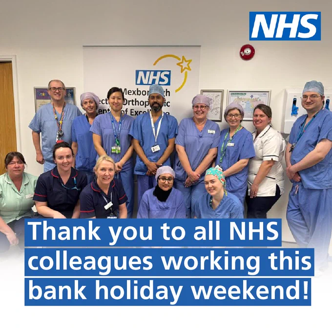 Thank you to all NHS colleagues working this bank holiday weekend! The image shows a team of NHS staff who are all smiling and standing side by side.