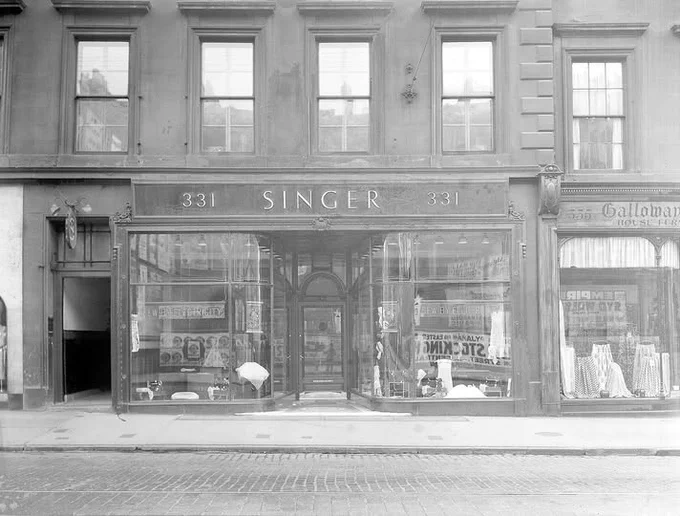 Shop fronts at 325-331 Sauchiehall St, 1939, including Singer Sewing Machine Co.
Archive Ref:  D-CA8/2919
